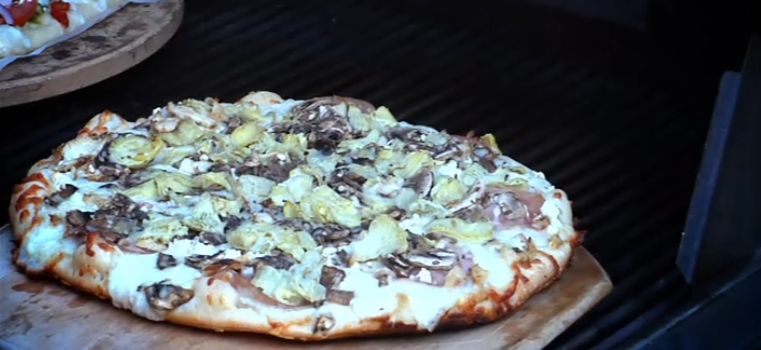 Pizza baking on a home BBQ grill